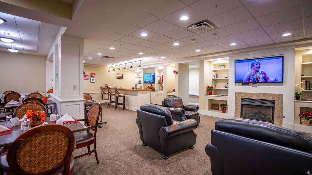 Living area with fireplace in Harmony Trace