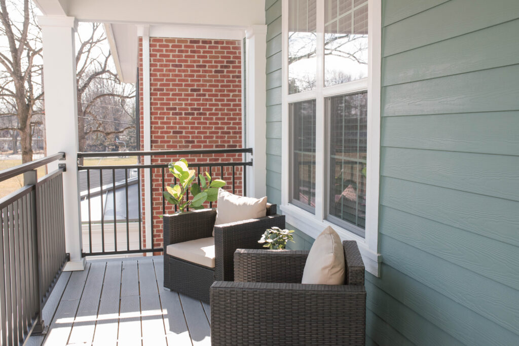 Modern balcony with two wicker chairs