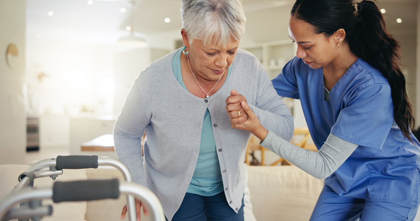 Senior woman, person with disability and nurse for help to couch, walking frame and handholding. Healthcare or elderly for medical, patient rehabilitation and injury for therapy, support or recovery