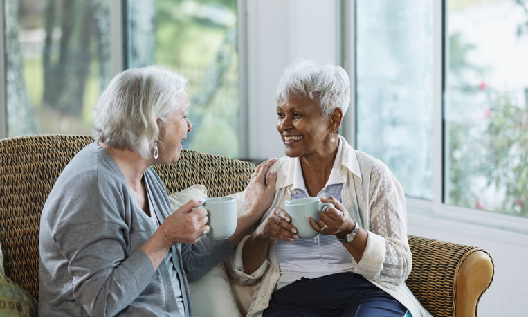 Seniors enjoying a cup of coffee socializing
