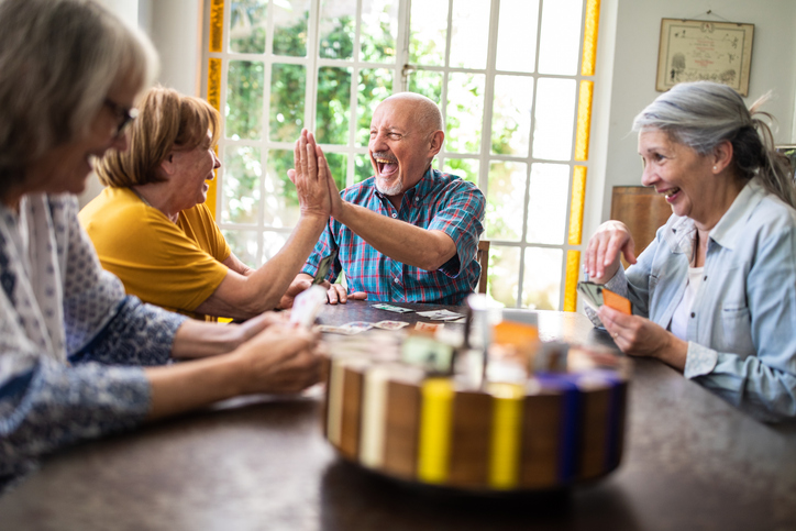 Group of seniors enjoying a game of cards