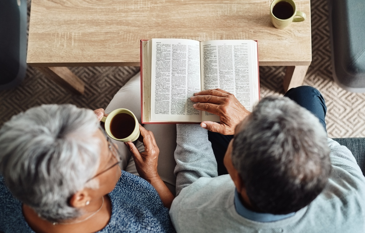 Senior reading enjoying coffee