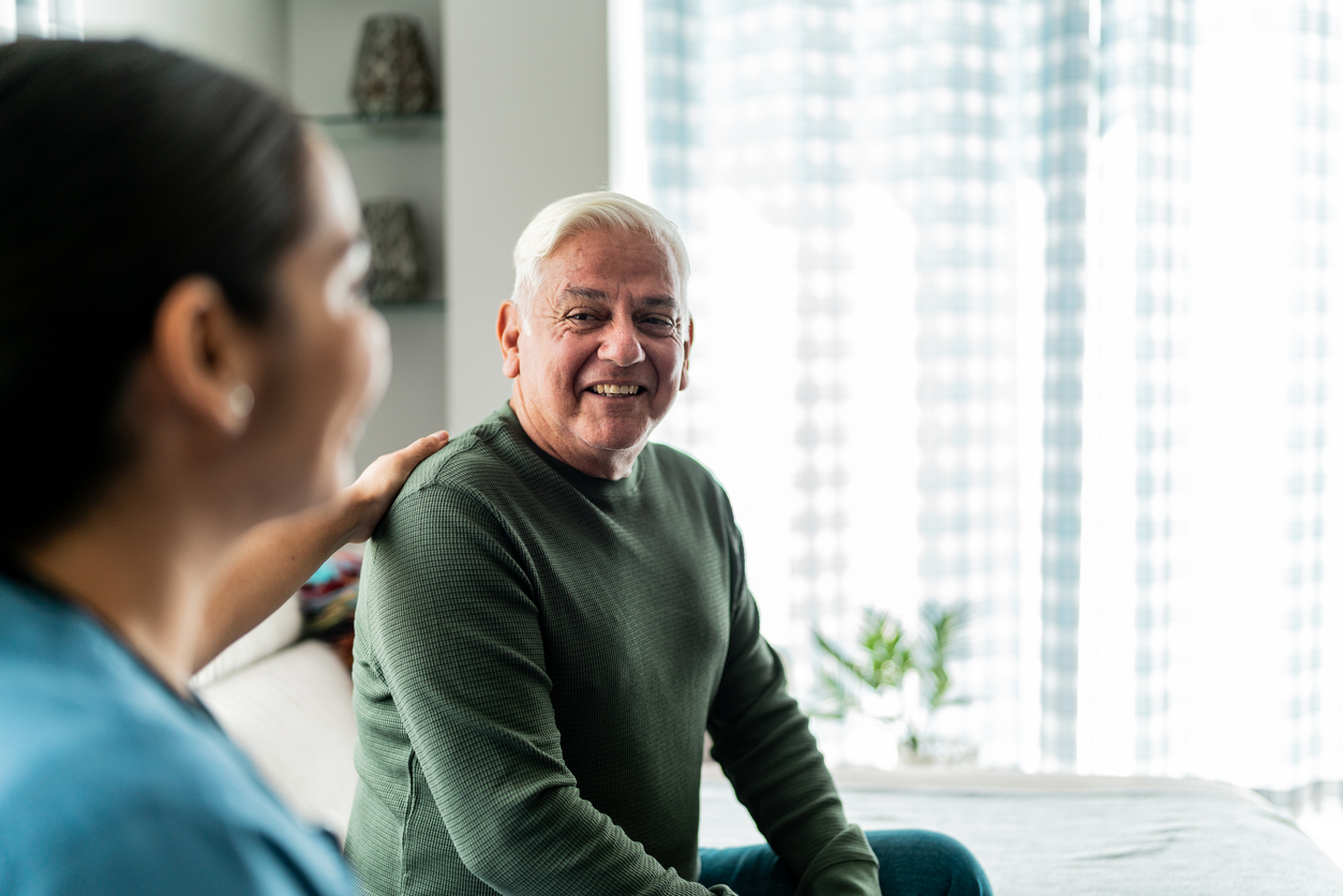 Senior with caregiver at check up