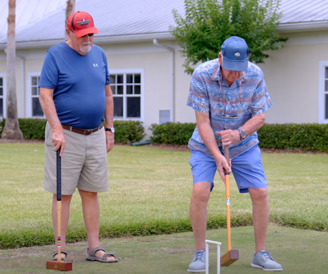 Seniors playing croquet