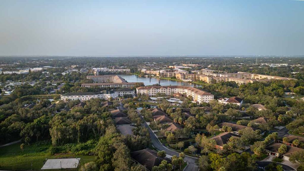 Aerial view of residential community and lake