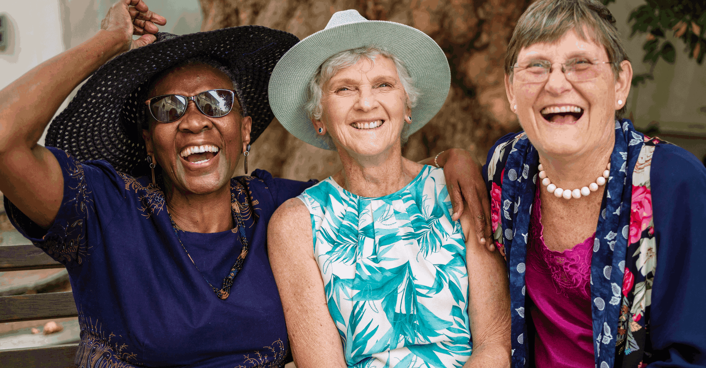 Three happy senior women laughing together
