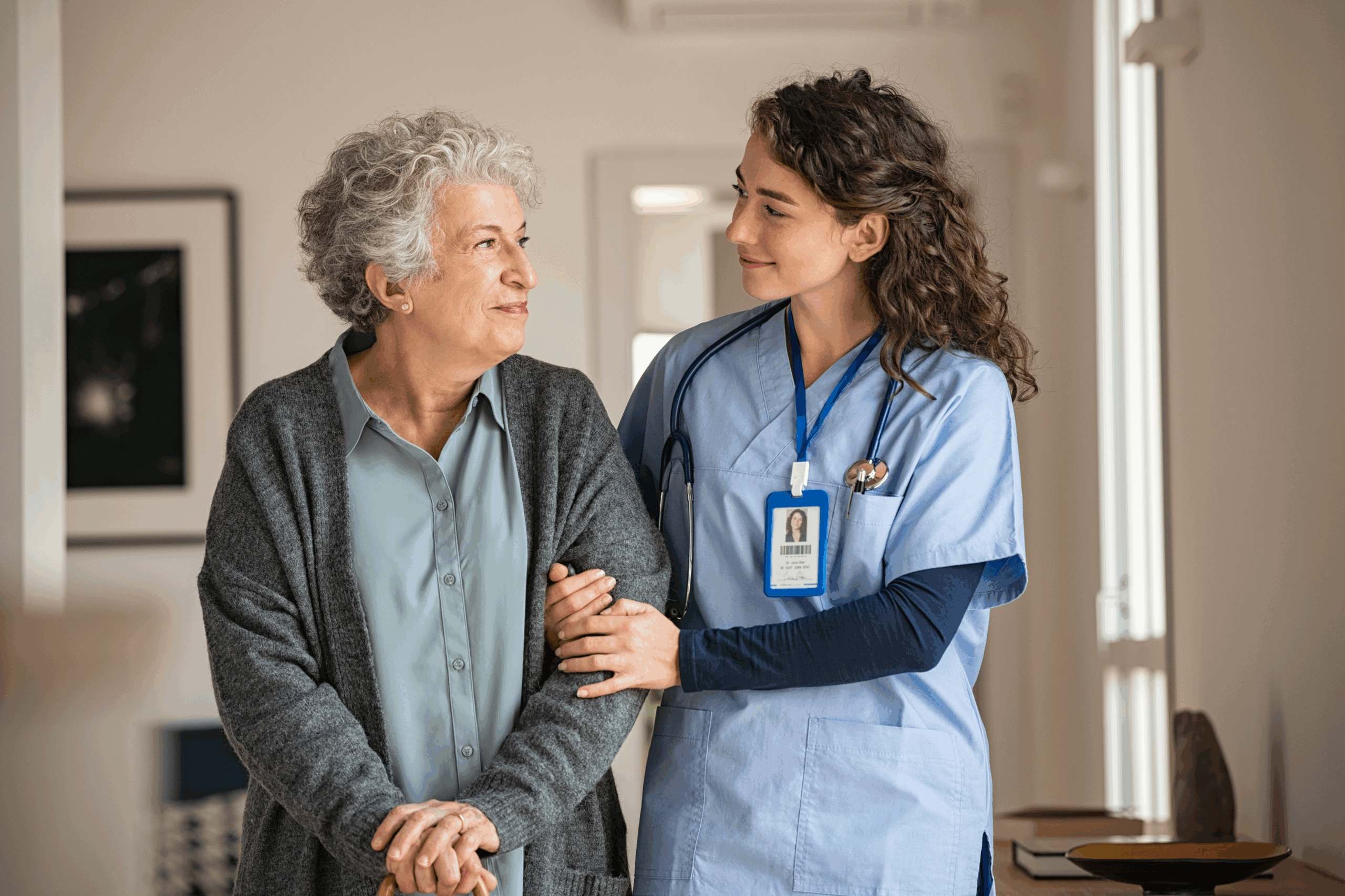 Senior assisted by caregiver